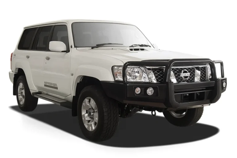 White Nissan Patrol wagon with a black steel bull bar